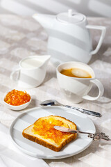 breakfast with toast and  jam. vertical image. selective focus