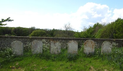 Fototapeta na wymiar View of the cemetery next to the old church