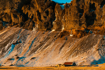 A lonely house at the foot of the mountains in Iceland. Incredible landscapes of nature. Life for a...