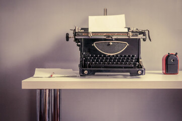 Vintage typewriter's, piles of blank sheets, old-timey writer and blogger concept, insiration