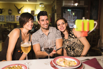 Group of friends having dinner in restaurant bar