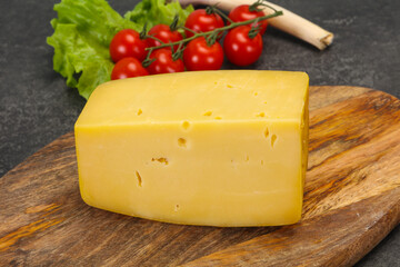 Hard yellow tasty cheese brick