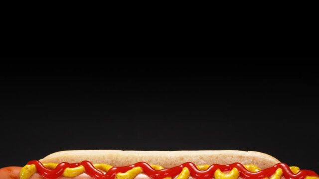 Go from black to hot dog with grilled sausage, ketchup and mustard.