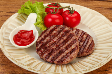Grilled burger cutlet with sauce