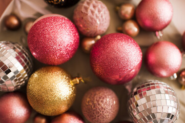 Shiny Christmas decorations closeup top view. Winter holiday season. Selective focus.
