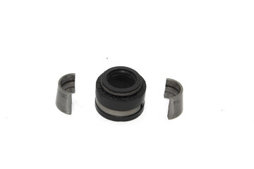 Old used oil seal on white background