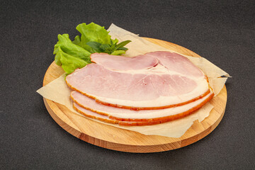 Sliced pork belly over board