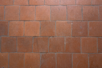 Obraz premium Old brown square tiles on the factory floor