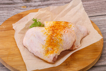 Raw chicken thigh with spices