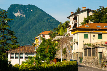 Lovely Street in Loppia on Lake Como in Northern Italy. The Italian Alps can be seen in the distance