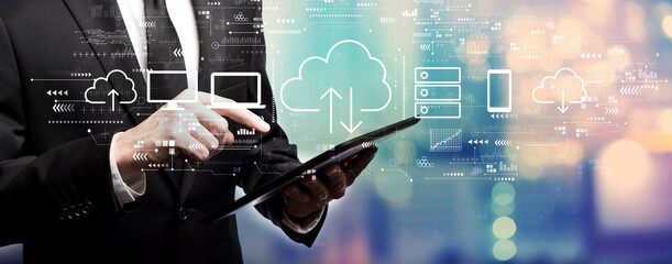 Cloud computing with businessman using his tablet computer