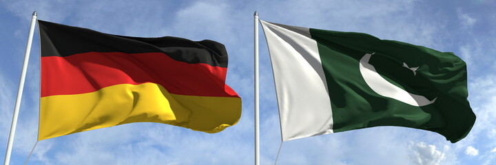 Flags of Germany and Pakistan on flagpoles. 3d rendering