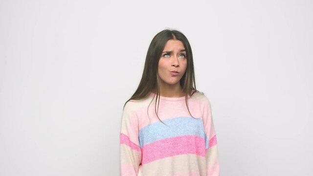 Young cute woman confused, feels doubtful and unsure
