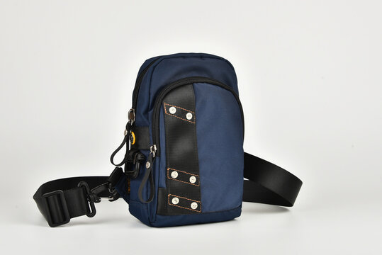 A small shoulder bag for documents and small items on a white background. A must have accessory for travel.