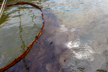 Ecological catastrophy. Close-up. Spill of oil products into the sea.