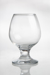empty glass for cognac on white background