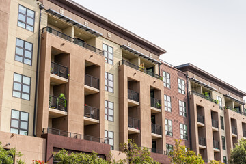 Exterior view of modern apartment building offering luxury rental units in Silicon Valley; Redwood City, San Francisco bay area, California