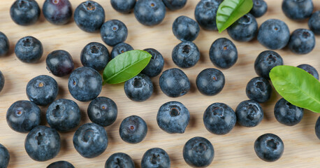 blueberries berries on wooden background top view