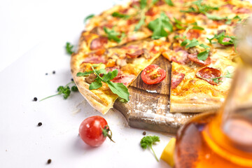 Italian pizza with pepperoni, mozzarella and tomato sauce wooden table