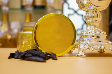 Incense con in golden jar with trophy, in shop