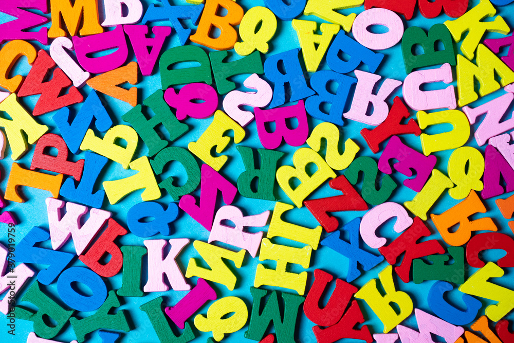 Fototapete the colorful background is made of letters of the alphabet. background of bright letters of the alph
