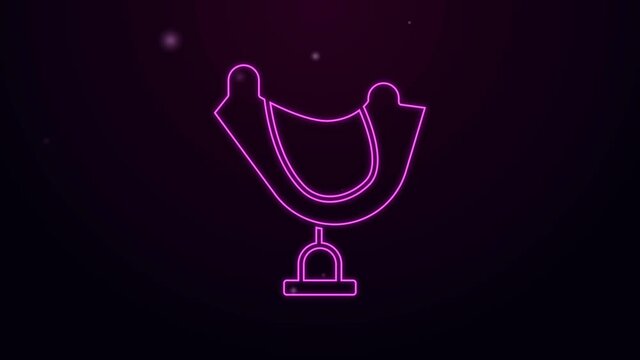 Glowing neon line Wild west saddle icon isolated on purple background. 4K Video motion graphic animation.