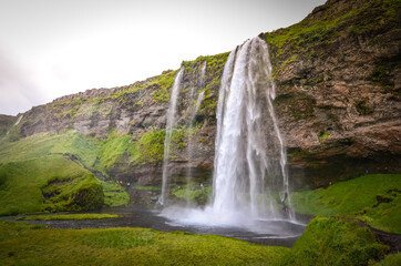 The photo shows beautiful Seljalandfoss waterfall in Iceland.
