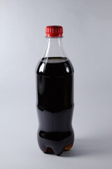 Soft drink with red cap and white background