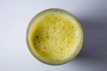 Glass of passion fruit juice with foam