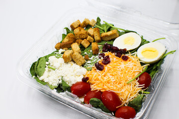 To Go Salad with Croutons, Tomatoes, Eggs, Cranberries and Shredded Cheese