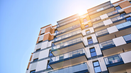 Architectural details of modern apartment building. Modern european residential apartment building complex. Sunset.