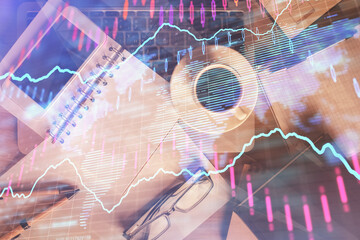 Double exposure of forex chart hologram over desktop with phone. Top view. Mobile trade platform concept.