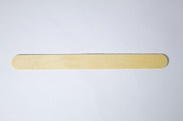 Popsicle stick on wood with white background