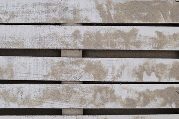 Textura de passadiço de uma praia construído em madeira pintado de branco com areias por cima