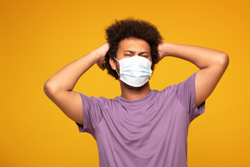 Afro man wearing medical mask .