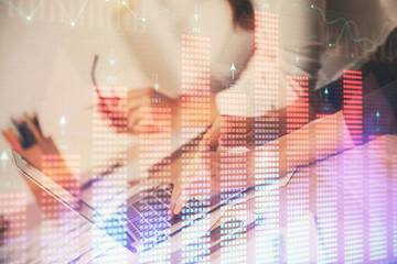 Multi exposure of woman hands typing on computer and financial chart hologram drawing. Stock market analysis concept.