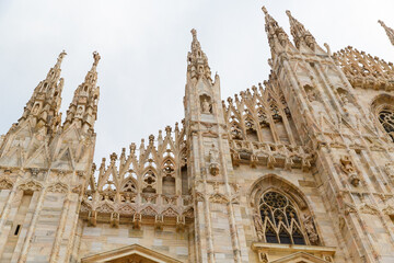 Fototapeta premium Milan, Italy September 19, 2019. Details of the facade Milan Cathedral Duomo di Milano (Cattedrale di Santa Maria Nascente) on Square Piazza Duomo.