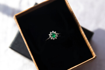 emerald stone diamond ring in gift box
