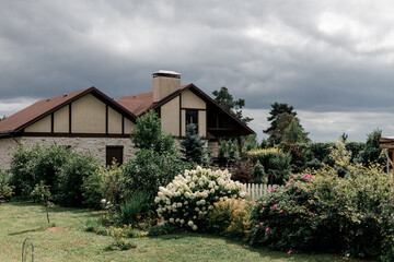 Beautiful modern cottage with flower garden.