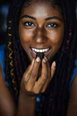 Young black woman eating chocolate