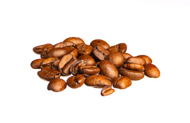 Roasted coffee beans lie in a small heap isolated on white background