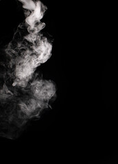 Descending stream of white smoke swirls chaotically in whimsical patterns on a black background
