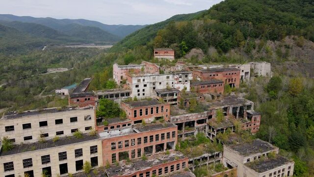 View from above. Abandoned tin mining plant in Russia. Flying over the permitted buildings of the mining and processing plant in Kavalerovo