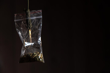 drug trap concept: drug bag with triple hook inside
