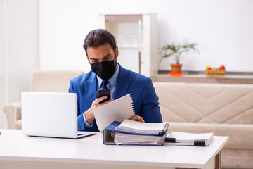 Young male employee in self-quarantine concept