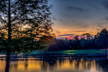 Sunrise over lake with reflections in the water on a fall day 
