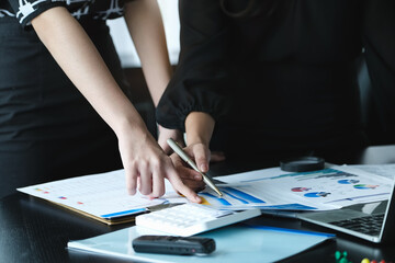 A female business consultant describes a marketing plan to set business strategies for women business owners.