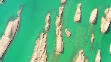 aerial view of sand island in green lake 