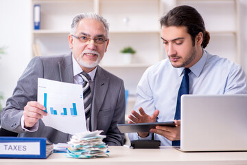 Two accountants working in the office