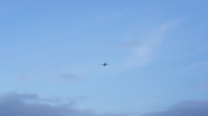 Departing plane in the sky, turboprop plane against the sky.